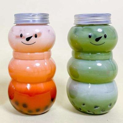 En stock 300ml / 500ml Botella de agua de plástico para el regalo de Navidad Diseño de muñeco de nieve encantador