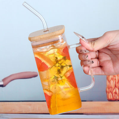 Botella de agua potable de copa de vidrio personalizada de 350 ml con tapa de grano de madera y forma cuadrada
