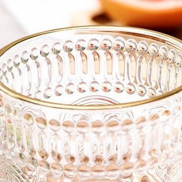 OEM creativo retro embossed girasol whisky jugo de leche tumbler copa de agua de vidrio resistente al calor