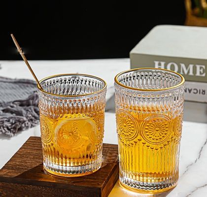 Taza de vidrio con borde de oro con diseño de girasol y estilo clásico
