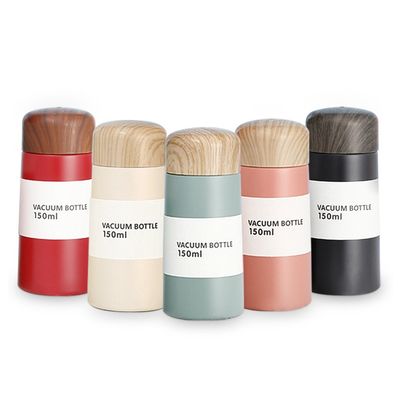 Térmosas de vacío de acero inoxidable 304 personalizadas Bpa Bebidas para niños Botella de agua con tapa de madera